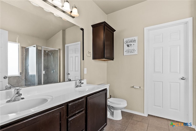 bathroom featuring vanity, walk in shower, tile patterned flooring, and toilet