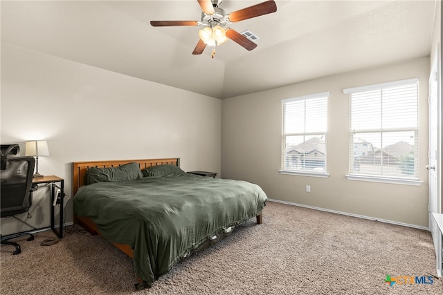 bedroom featuring carpet floors, lofted ceiling, and ceiling fan