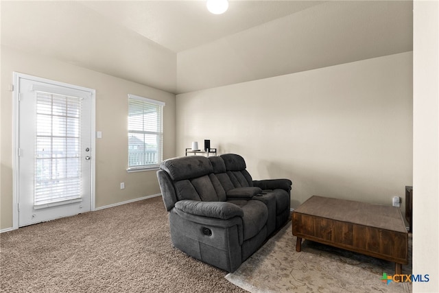 sitting room with carpet and lofted ceiling