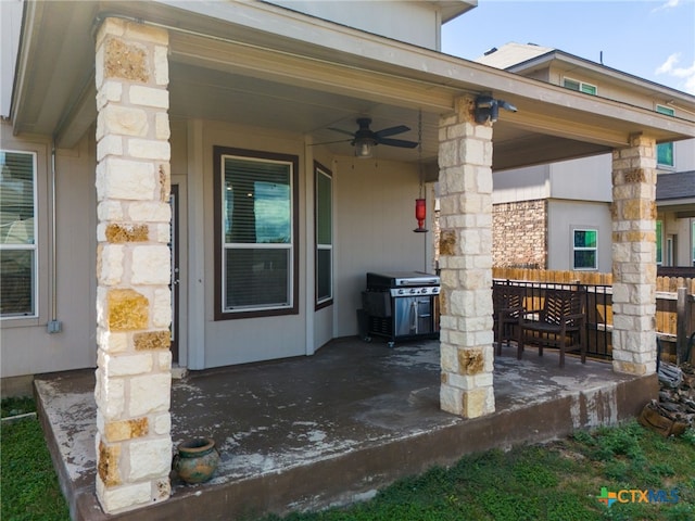 view of patio with ceiling fan and a grill