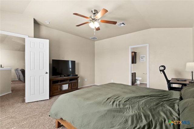 bedroom with carpet flooring, ensuite bathroom, lofted ceiling, and ceiling fan