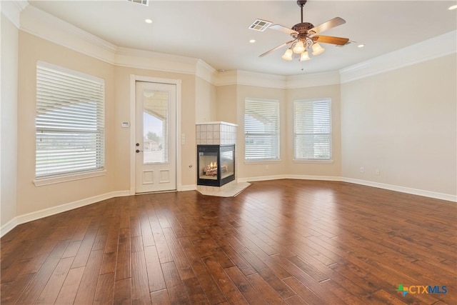2747 Hester Way, Salado, TX 76571 - unfurnished living room with ceiling fan, a tile fireplace, dark wood-style flooring, baseboards, and crown molding