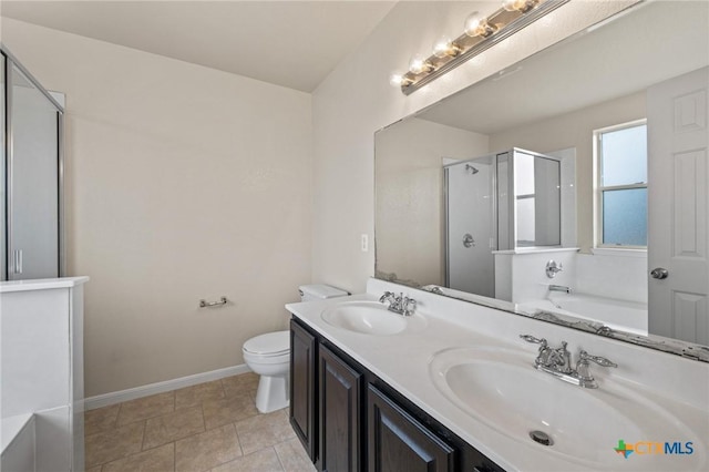 711 Leo Ln, Killeen, TX 76542 - bathroom with a stall shower, a bath, and double vanity