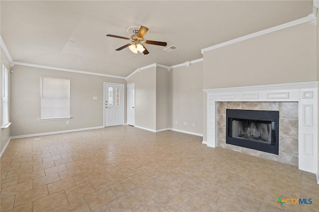 711 Leo Ln, Killeen, TX 76542 - unfurnished living room featuring a ceiling fan, crown molding, and a tile fireplace