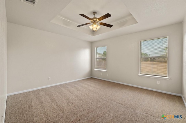 711 Leo Ln, Killeen, TX 76542 - carpeted spare room with a tray ceiling and a ceiling fan
