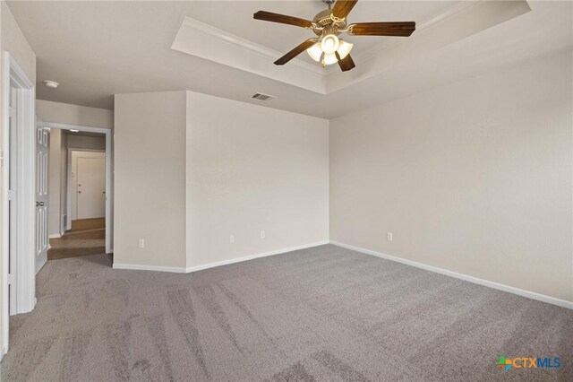 711 Leo Ln, Killeen, TX 76542 - carpeted empty room with a raised ceiling, ceiling fan, and crown molding