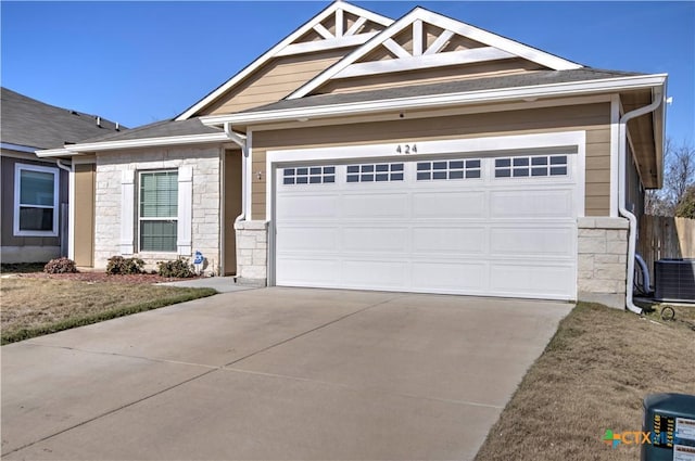 view of front of house with cooling unit and a garage