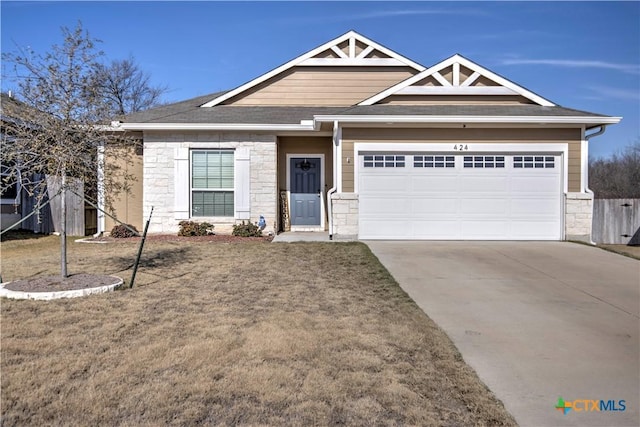 view of front of house with a garage and a front yard