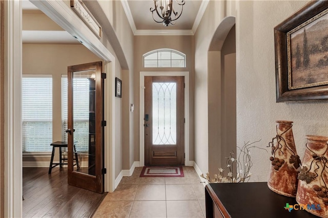3308 Ten Bits Dr, Belton, TX 76513 - entryway featuring plenty of natural light, crown molding, arched walkways, baseboards, and a chandelier