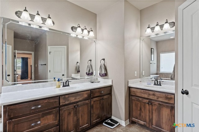3308 Ten Bits Dr, Belton, TX 76513 - bathroom featuring two vanities and tile patterned floors