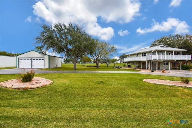 view of yard featuring an outbuilding and a garage