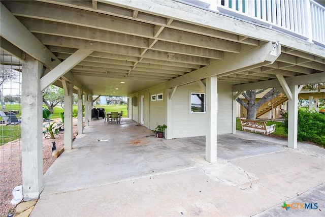 view of patio / terrace featuring area for grilling and a carport