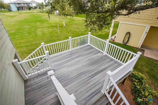 wooden terrace with a lawn