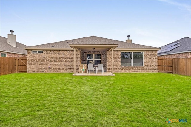 1703 Fossil Trl, Belton, TX 76513 - rear view of house with a patio area, a fenced backyard, and brick siding