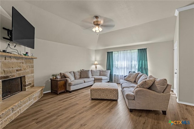 1703 Fossil Trl, Belton, TX 76513 - living area featuring ceiling fan, wood finished floors, vaulted ceiling, and a stone fireplace