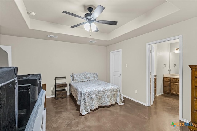 1703 Fossil Trl, Belton, TX 76513 - bedroom with a raised ceiling, baseboards, concrete flooring, and visible vents