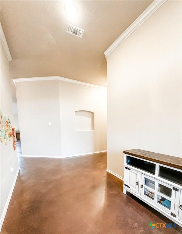 interior space with crown molding