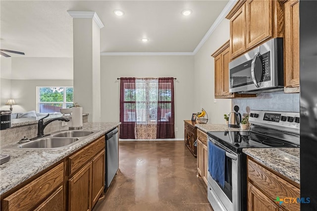 1703 Fossil Trl, Belton, TX 76513 - kitchen featuring brown cabinets, ceiling fan, appliances with stainless steel finishes, a sink, and finished concrete floors