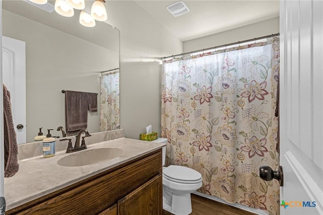 1703 Fossil Trl, Belton, TX 76513 - full bath with vanity, wood finished floors, and a shower with curtain