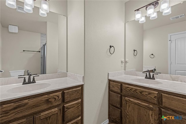 1703 Fossil Trl, Belton, TX 76513 - full bath featuring visible vents, two vanities, and a sink