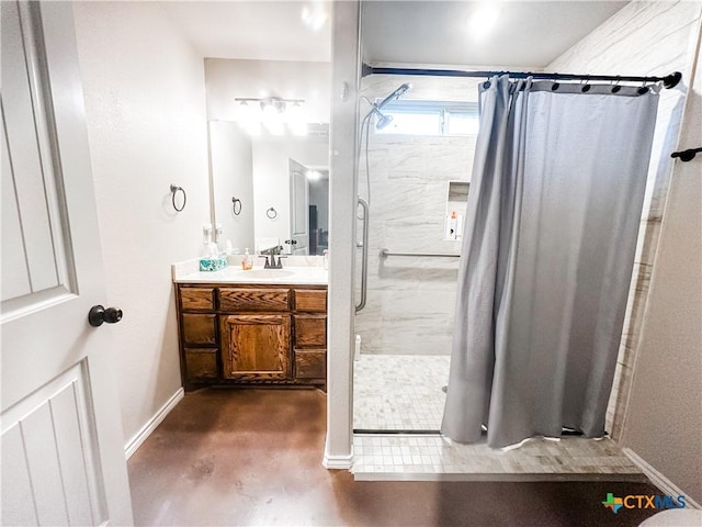 bathroom with walk in shower and vanity