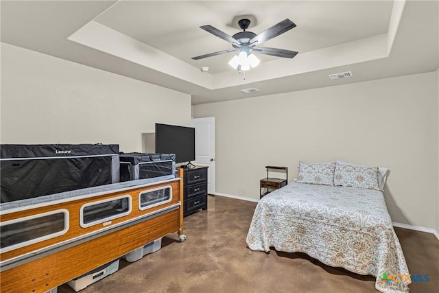 1703 Fossil Trl, Belton, TX 76513 - bedroom featuring visible vents, finished concrete flooring, baseboards, and a tray ceiling