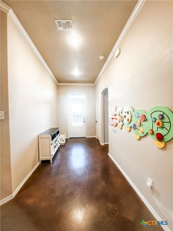 corridor featuring ornamental molding