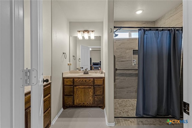 1703 Fossil Trl, Belton, TX 76513 - full bath with vanity, tiled shower, and tile patterned floors