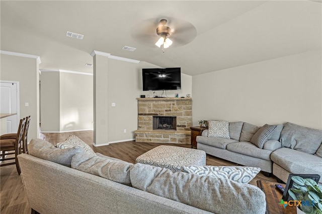 1703 Fossil Trl, Belton, TX 76513 - living area featuring a ceiling fan, vaulted ceiling, wood finished floors, crown molding, and a stone fireplace