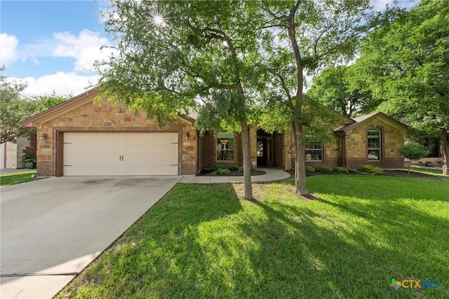 3201 Purple Sage Dr, Belton, TX 76513 - view of front of property featuring a front lawn, stone siding, brick siding, concrete driveway, and an attached garage