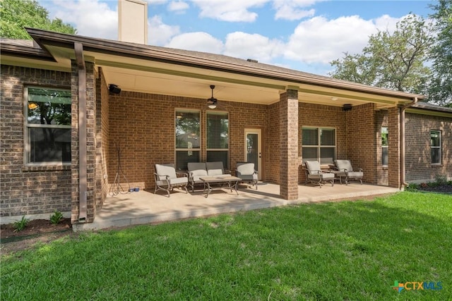 3201 Purple Sage Dr, Belton, TX 76513 - rear view of property with a chimney, brick siding, an outdoor hangout area, a yard, and a patio