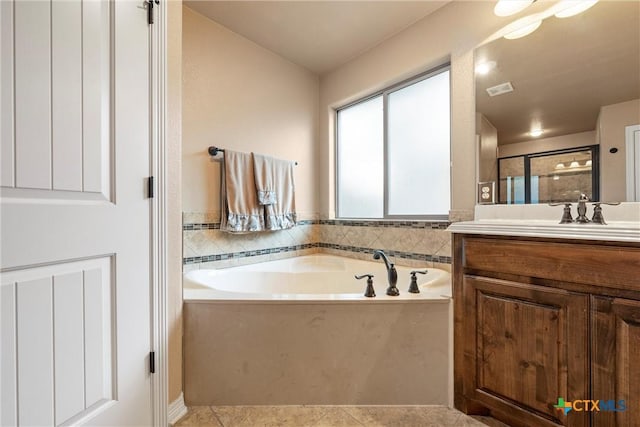 3201 Purple Sage Dr, Belton, TX 76513 - full bath featuring tile patterned flooring, vanity, a shower stall, visible vents, and a bath