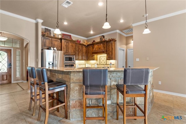 3201 Purple Sage Dr, Belton, TX 76513 - kitchen featuring arched walkways, stainless steel appliances, backsplash, visible vents, and ornamental molding