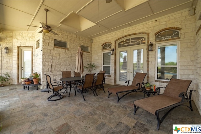 view of patio / terrace featuring ceiling fan and french doors