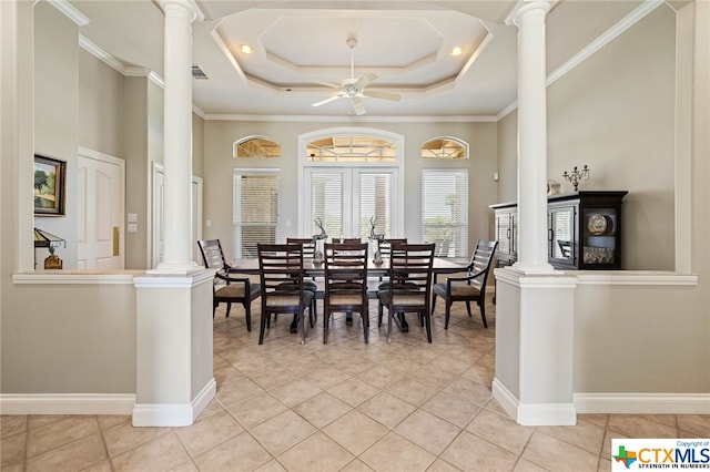 dining room with light tile patterned floors, a raised ceiling, ceiling fan, and crown molding