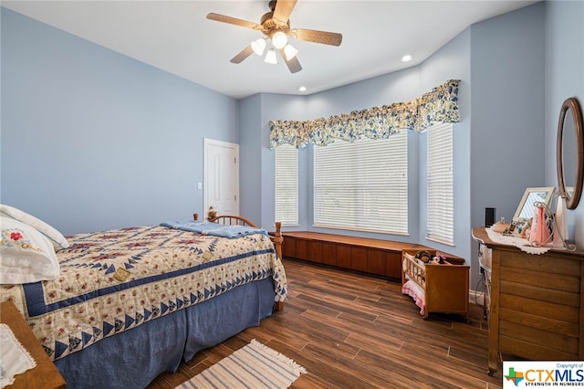 bedroom featuring ceiling fan and dark hardwood / wood-style floors