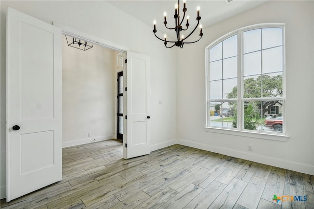 1923 Privet Rd, New Braunfels, TX 78132 - unfurnished dining area featuring a chandelier and wood finished floors
