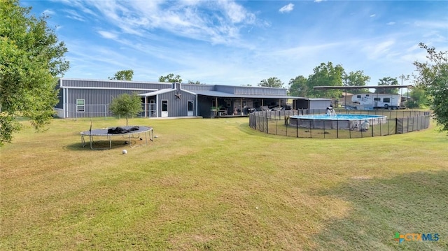 1622 Old Goliad Rd, Victoria, TX 77905 - view of yard with a trampoline and an outdoor pool