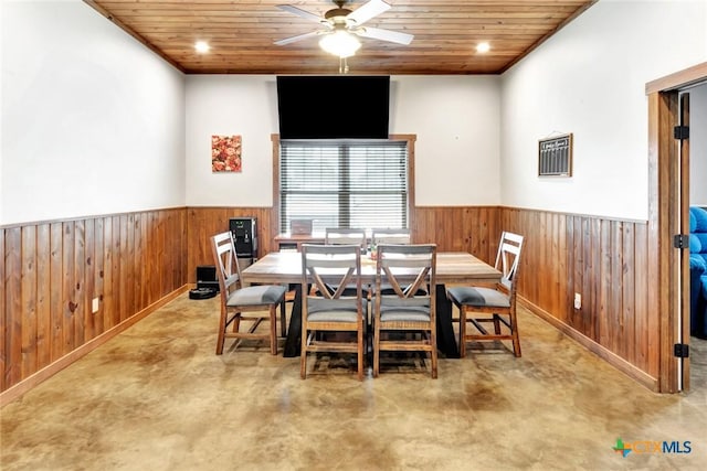1622 Old Goliad Rd, Victoria, TX 77905 - dining room with wood walls, wainscoting, a ceiling fan, and wooden ceiling