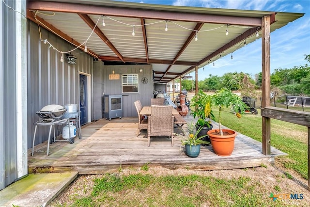 1622 Old Goliad Rd, Victoria, TX 77905 - wooden terrace featuring heating unit and outdoor dining area