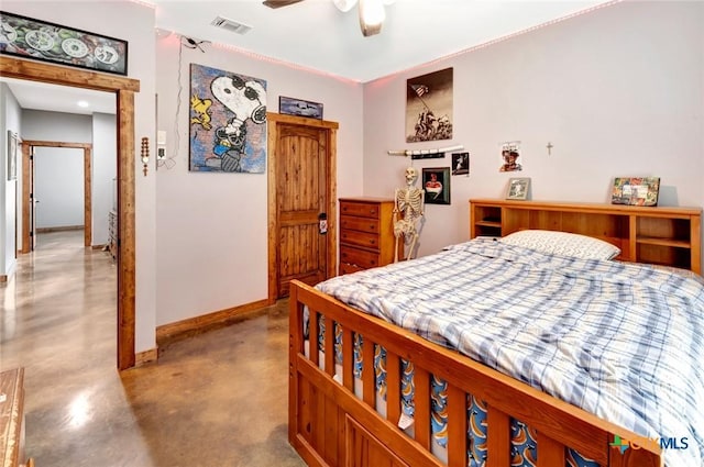 1622 Old Goliad Rd, Victoria, TX 77905 - bedroom featuring concrete flooring, baseboards, and ceiling fan