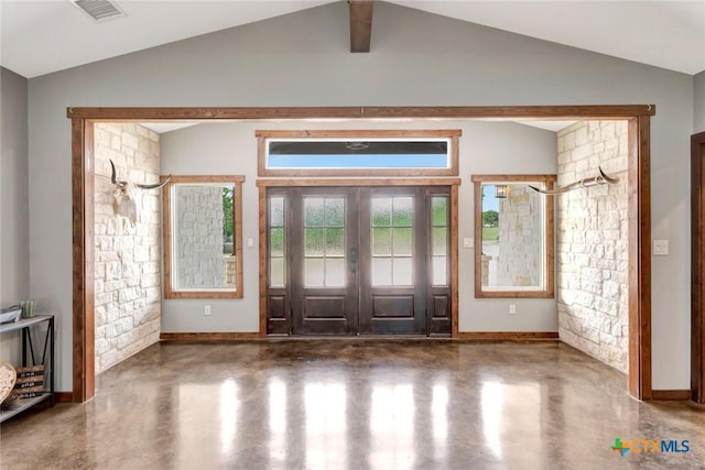 1622 Old Goliad Rd, Victoria, TX 77905 - foyer entrance featuring lofted ceiling, concrete floors, and baseboards