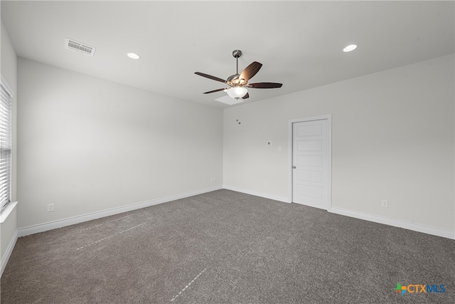 unfurnished room with ceiling fan and dark colored carpet