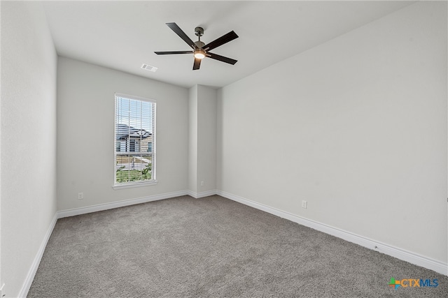 unfurnished room with carpet and ceiling fan