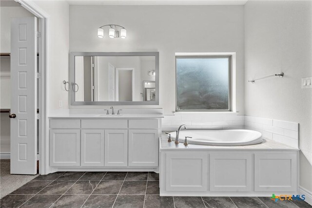 6402 Waggoner Ct, Temple, TX 76502 - bathroom with a bathing tub, tile patterned flooring, and vanity