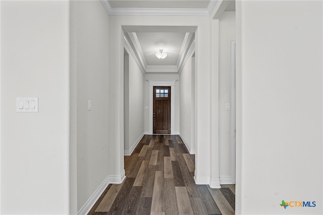 corridor with dark hardwood / wood-style floors and ornamental molding