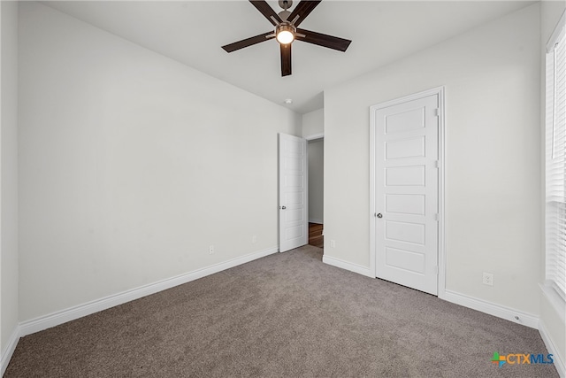 unfurnished bedroom featuring carpet and ceiling fan