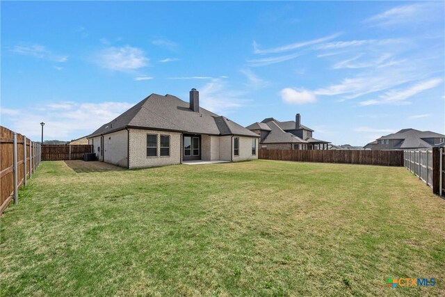 6402 Waggoner Ct, Temple, TX 76502 - rear view of property with a lawn and a patio