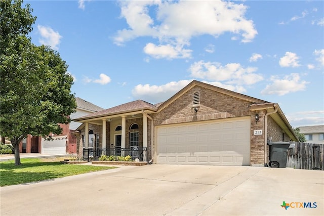 213 Gracie Ct, Harker Heights, TX 76548 - view of front of property featuring concrete driveway, an attached garage, fence, a porch, and stone siding
