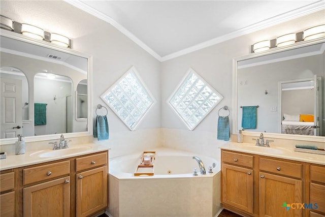 213 Gracie Ct, Harker Heights, TX 76548 - ensuite bathroom with a tub with jets, two vanities, and ornamental molding